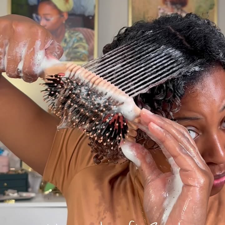 Instagram post by @miaa.ashantii for BounceCurl. Caption reads: I’m sure you’ve seen the @bouncecurl brush on your....
