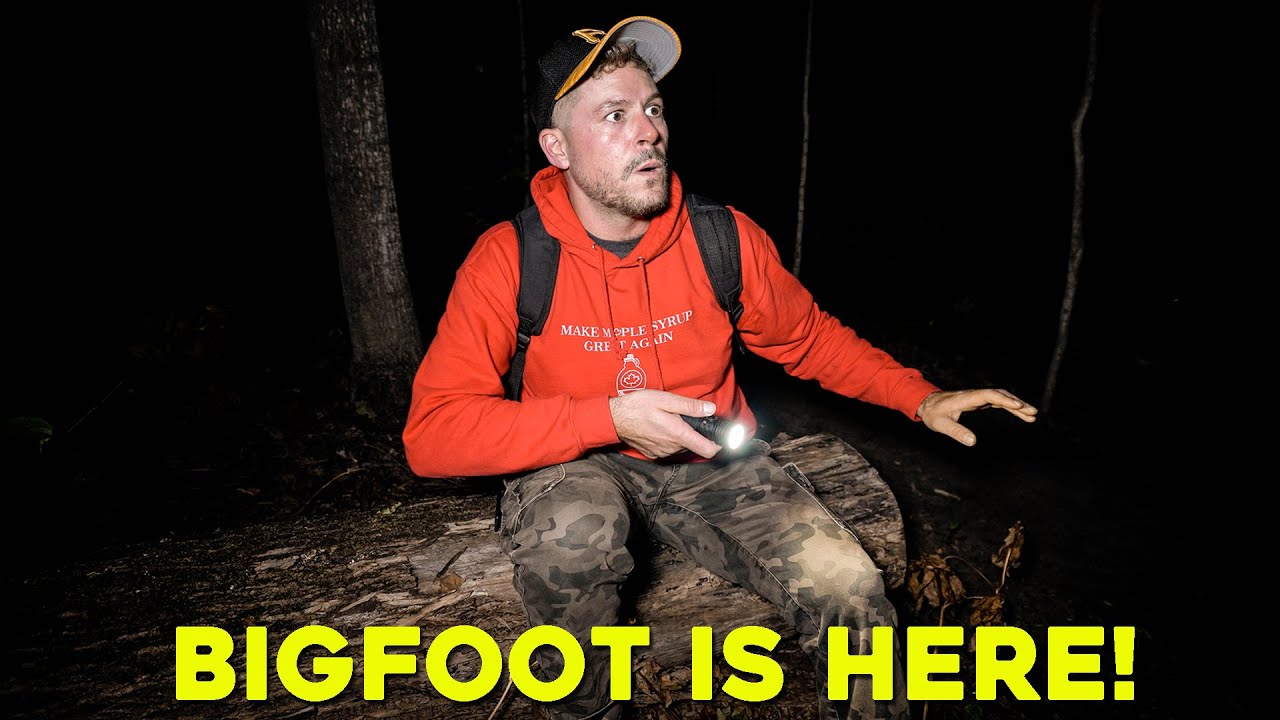 YouTube post by @AngBonaTV for OLIGHT. Caption reads: I Found BIGFOOT in the HAUNTED FOREST (Terrifying....