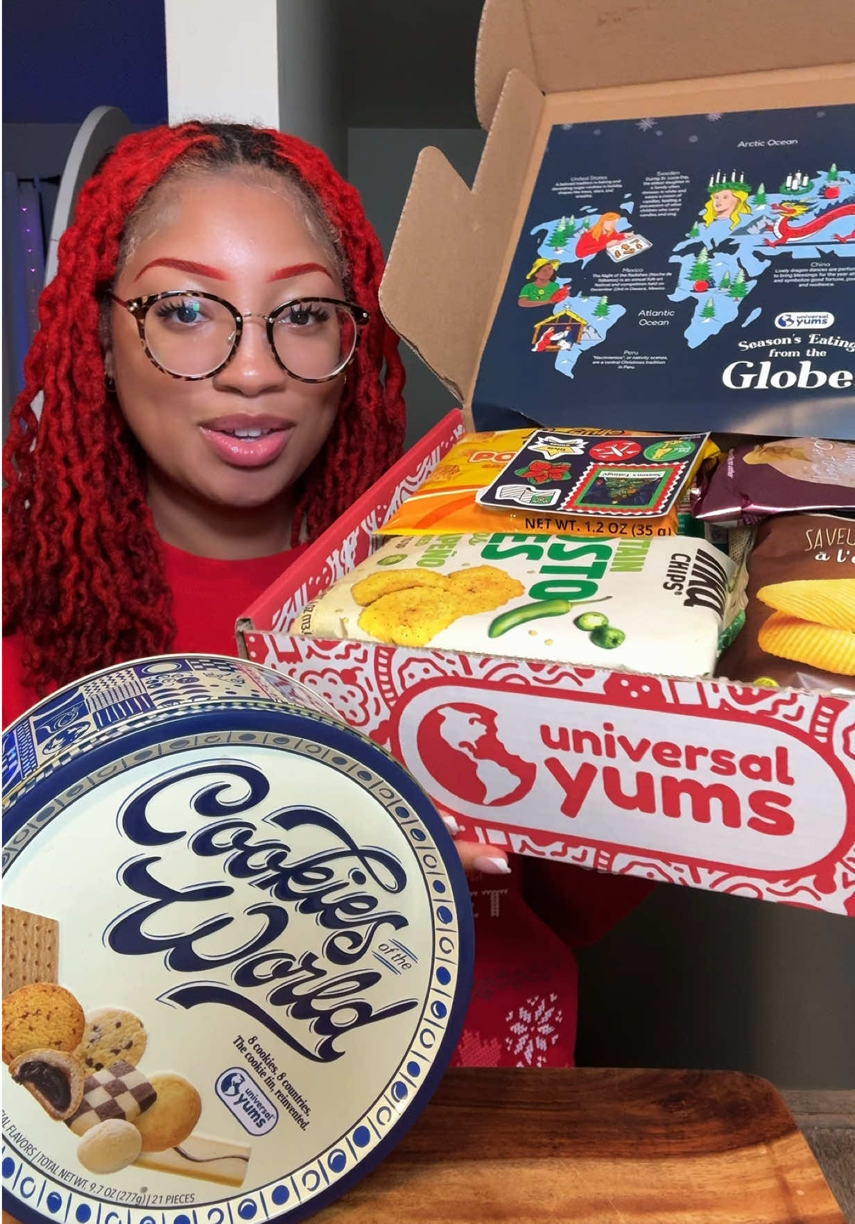 TikTok post by @kie_eats for Universal Yums. Caption reads: @Universal Yums holiday box and cookie tin is the....