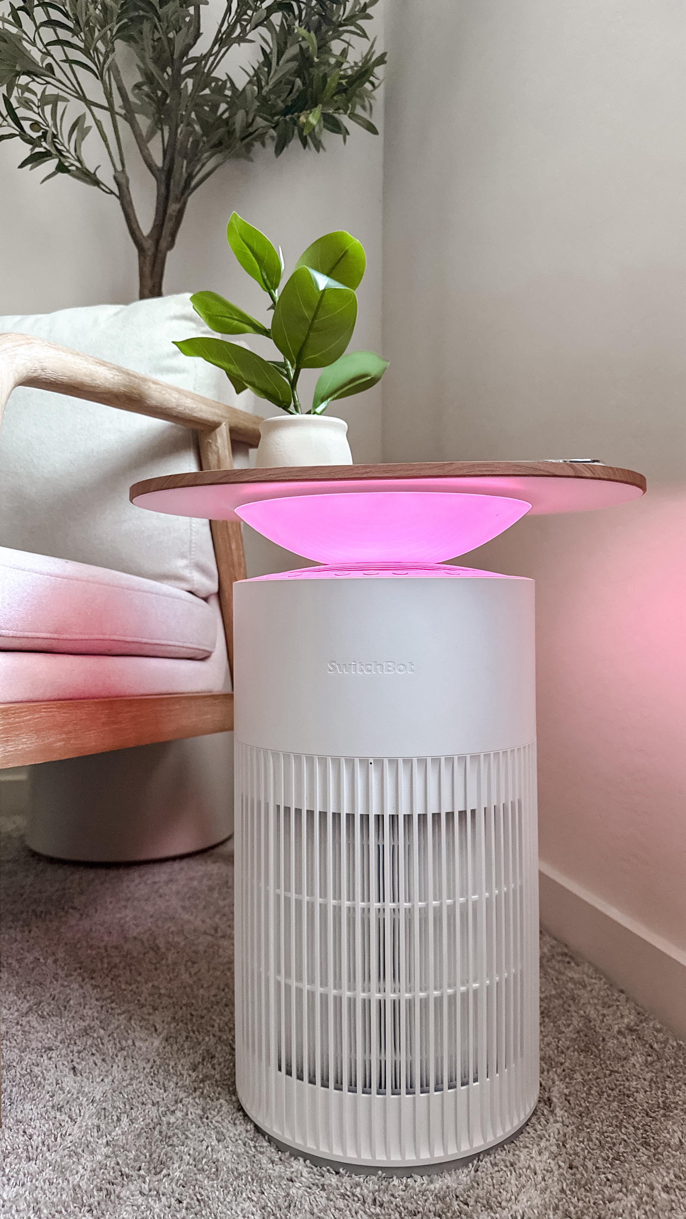 Instagram post by @allthingsjudyy for SwitchBot. Caption reads: This side table really does everything! air....