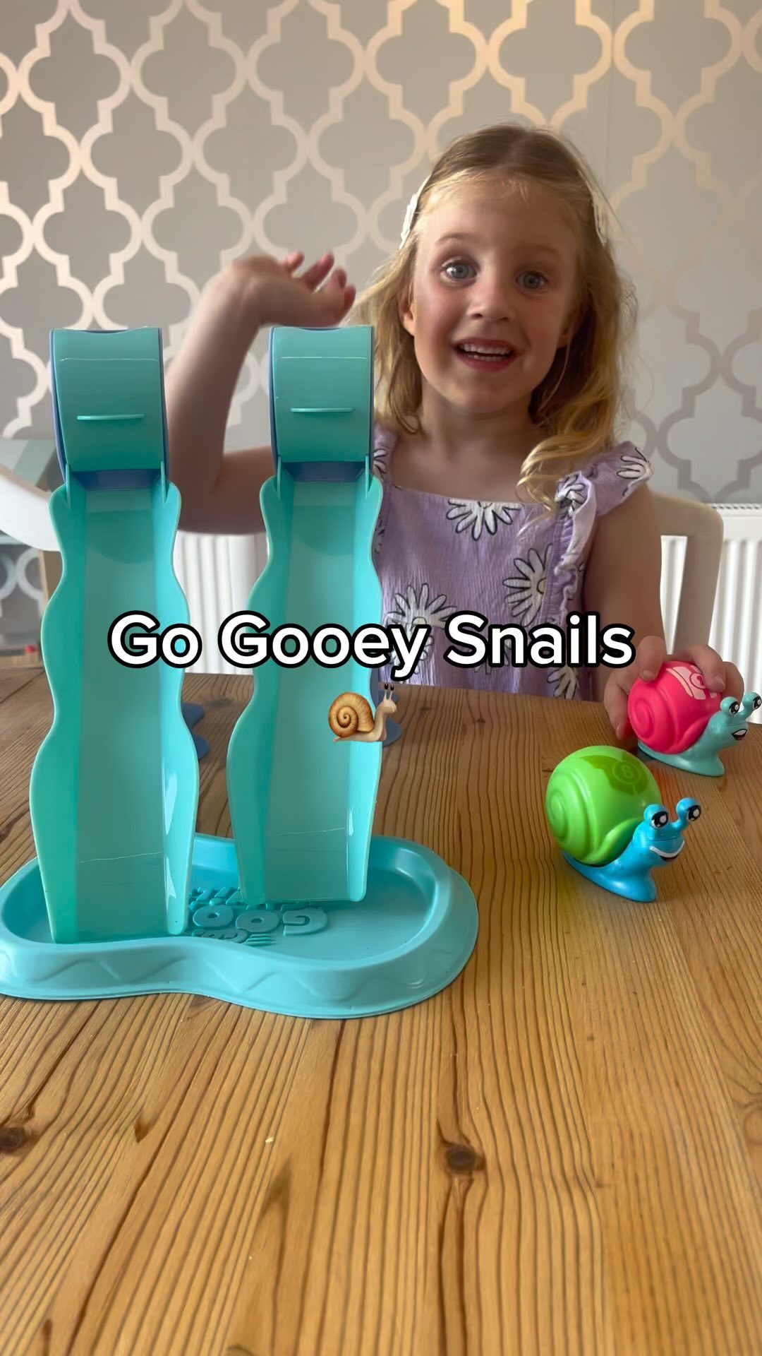 Instagram post by @twopreciouspearls for CANAL TOYS. Caption reads: Ruby Vs Daddy - Snail Slime Race 🐌 

Get ready....