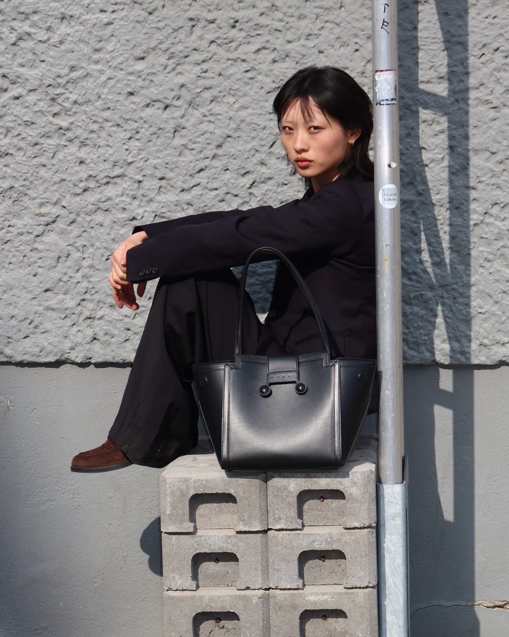 Instagram post by @sabrinaaalan_ for Marni. Caption reads: AD| Do you know what’s in my @marni bag?.