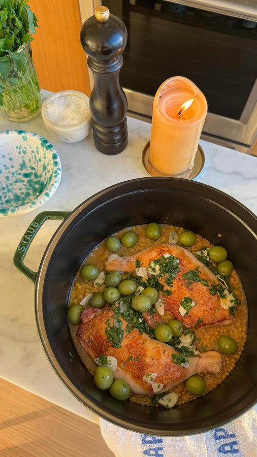 Instagram post by @justines.table for Mezzetta. Caption reads: Crispy chicken legs, golden turmeric couscous, and....