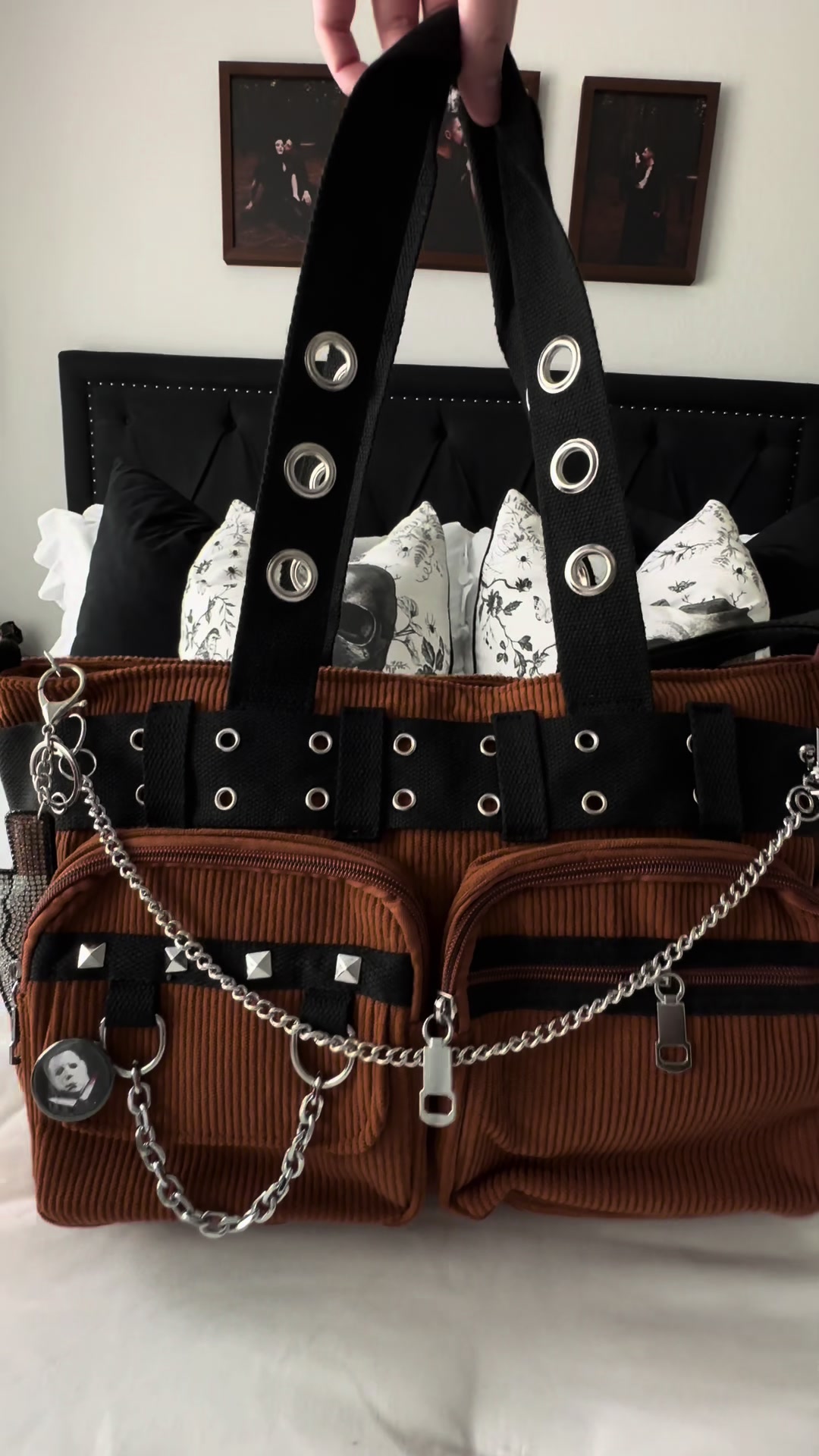 TikTok post by @ttrickorrtreatt for Spirit Halloween. Caption reads: [...] bag! Charms & chain from Pin: @Spirit....