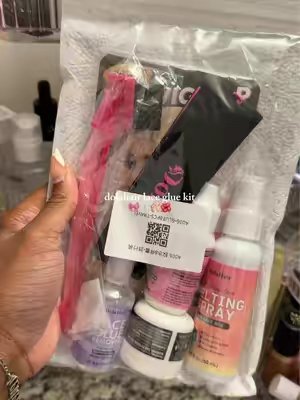 TikTok post by @theasiahrenee for DOLAHAIRCARE. Caption reads: [...] loved this lace glue kit from @DOLAHAIRCARE....