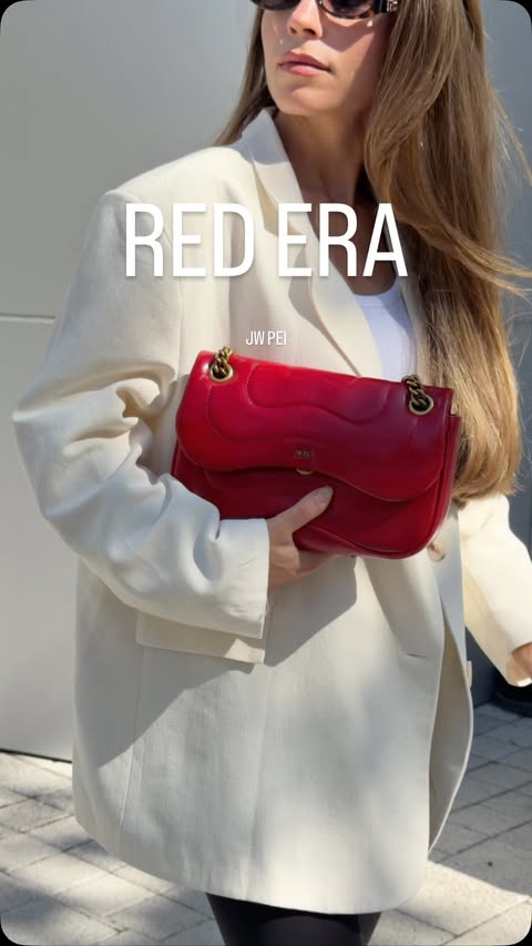 Instagram post by @hellobellalifestyle for JW PEI. Caption reads: [...] this season ❤️ this bag >>>>> gifted by....