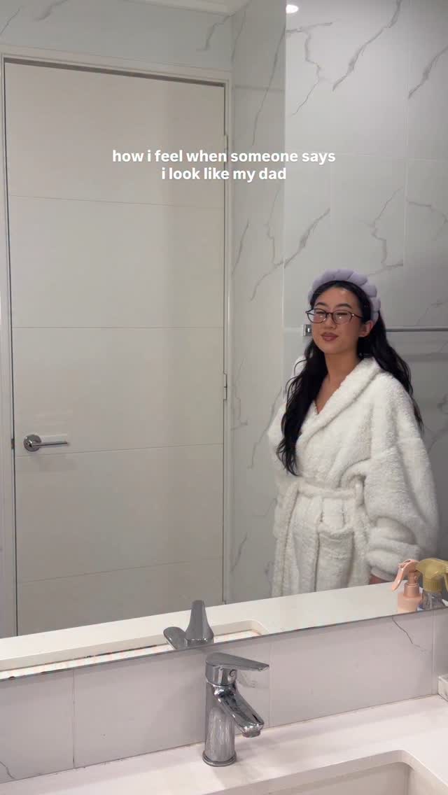 Instagram post by @amy.lien for The Oodie. Caption reads: be real, do i look like my dad? @the_oodie white....