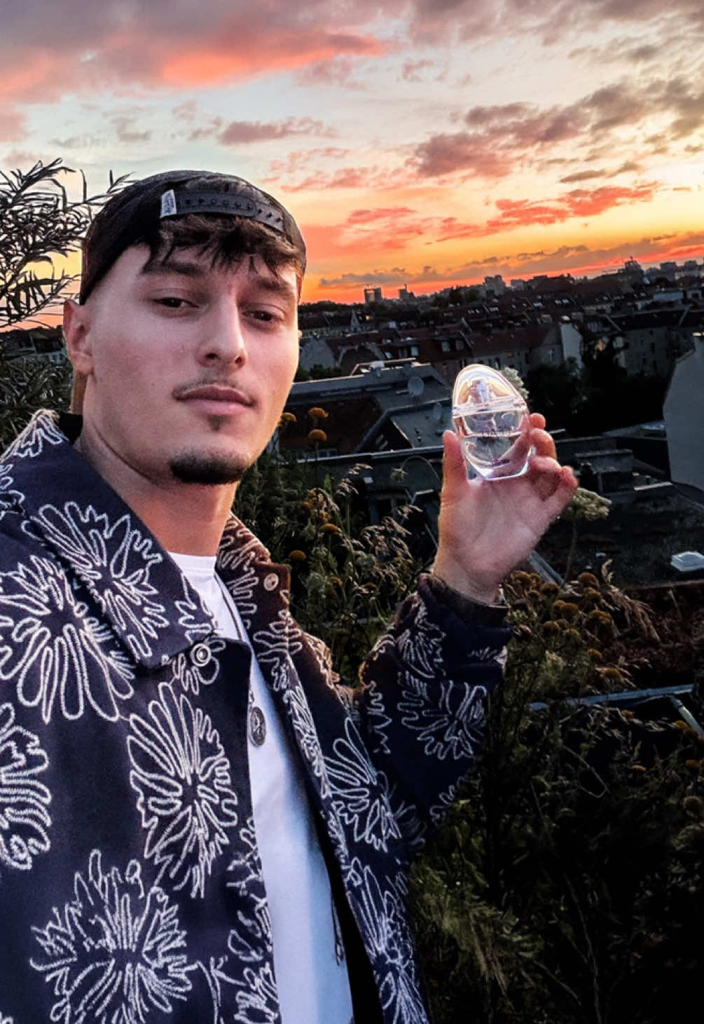 TikTok post by @nikolaisavic for KENZO Parfums. Caption reads: Fragrance transition today 👨🏼‍🍳🤝🏽....