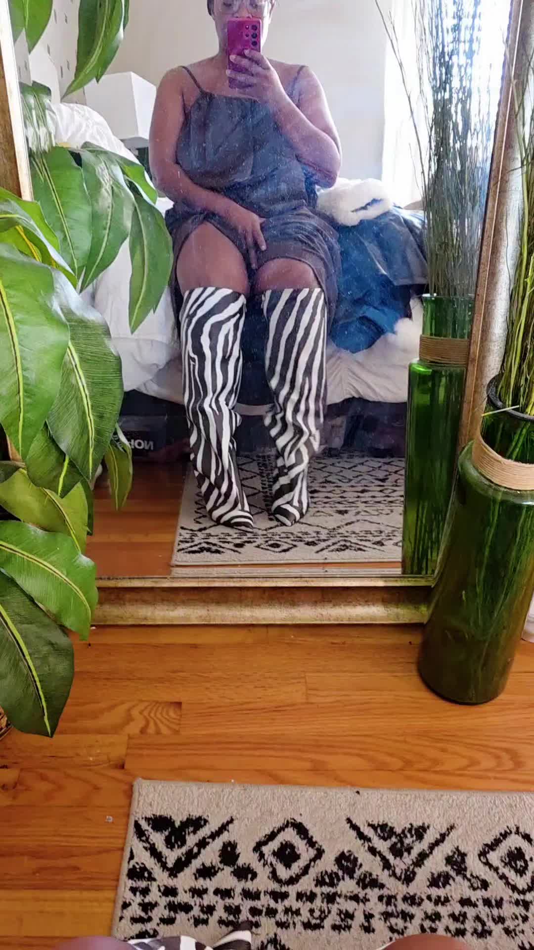 TikTok post by @brittbratstyles for Nine West. Caption reads: @AKIRA #boots #zebraprint.