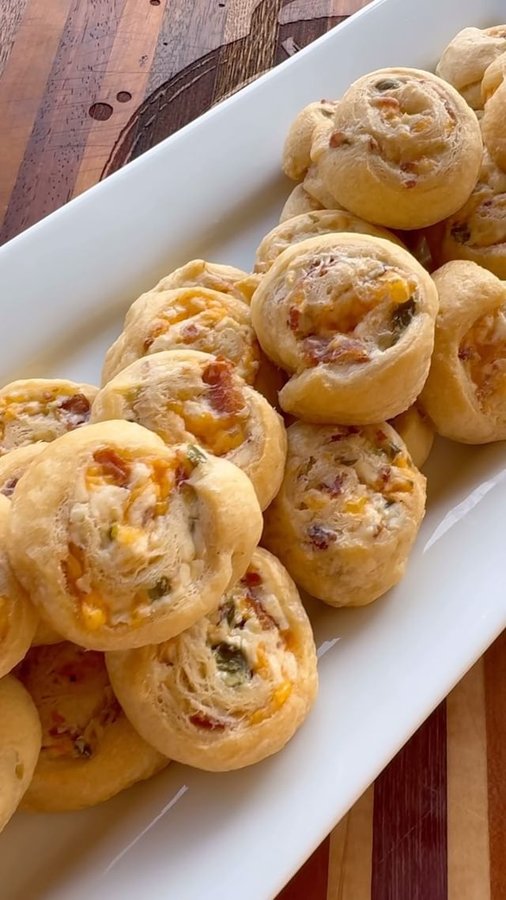 Instagram post by @cookinginthemidwest for Bear Mountain BBQ. Caption reads: #sponsored Smoked Bacon Cheddar Jalapeño Pinwheels....