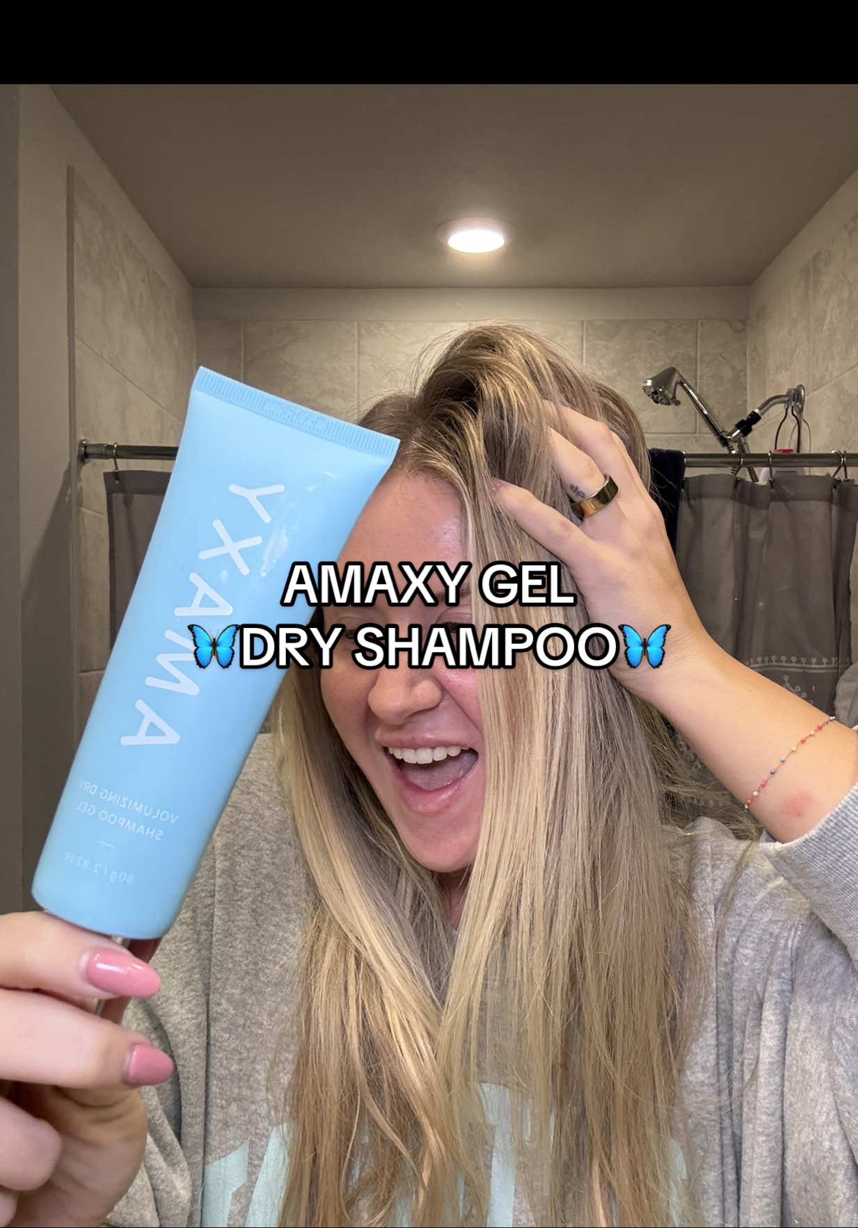 TikTok post by @skincareshay for AMAXY Beauty. Caption reads: Putting a wet dry shampoo on greasy hair sounds....
