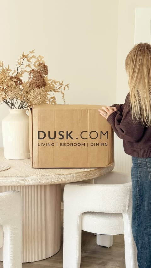 Instagram post by @cxurtniehome for DUSK. Caption reads: Unbox my @dusk.com delivery with me ☁️🤍 AD In....