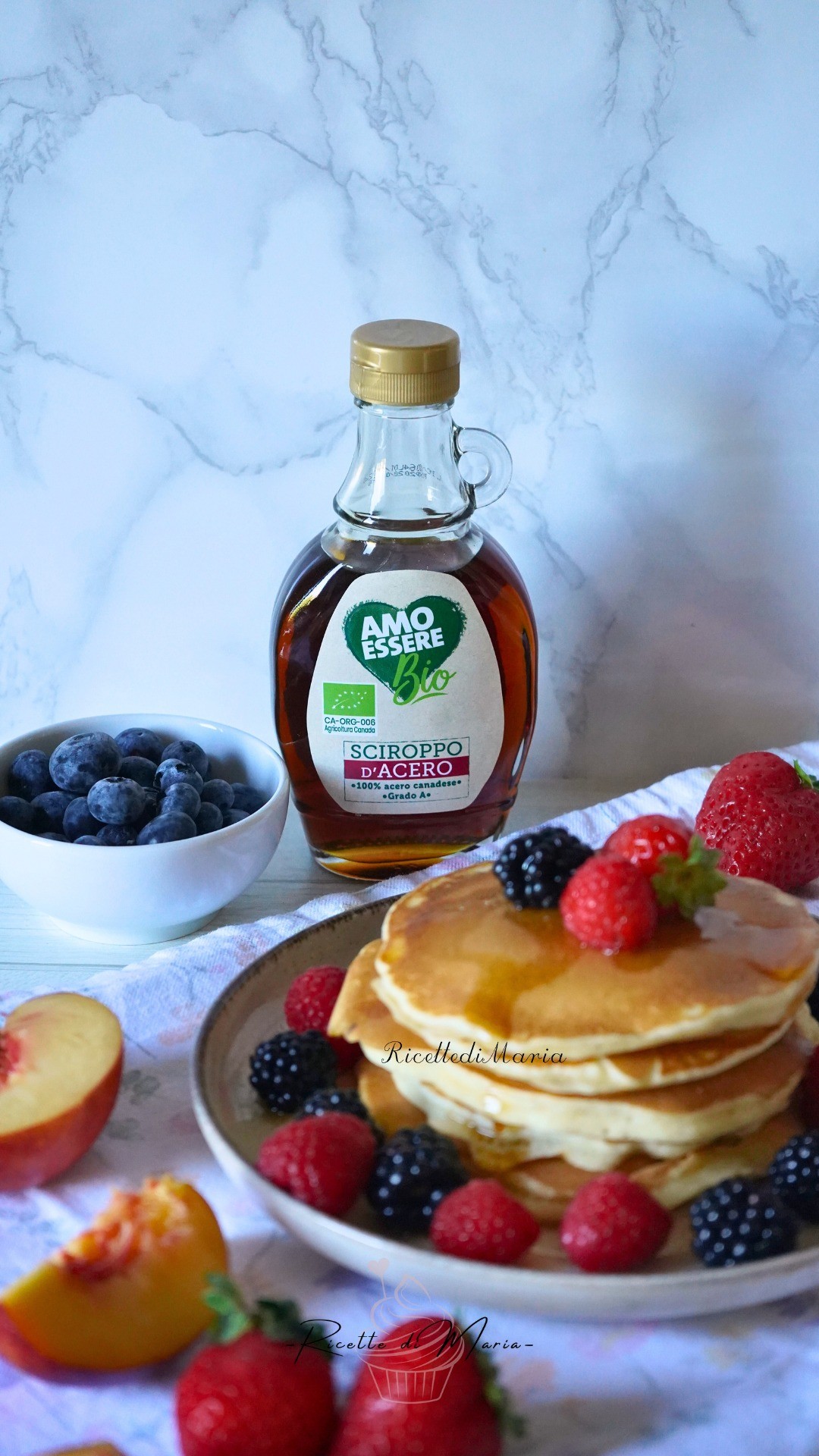 Instagram post by @ricettedimaria for Eurospin. Caption reads: Pancake soffici, frutta fresca e sciroppo d’acero....
