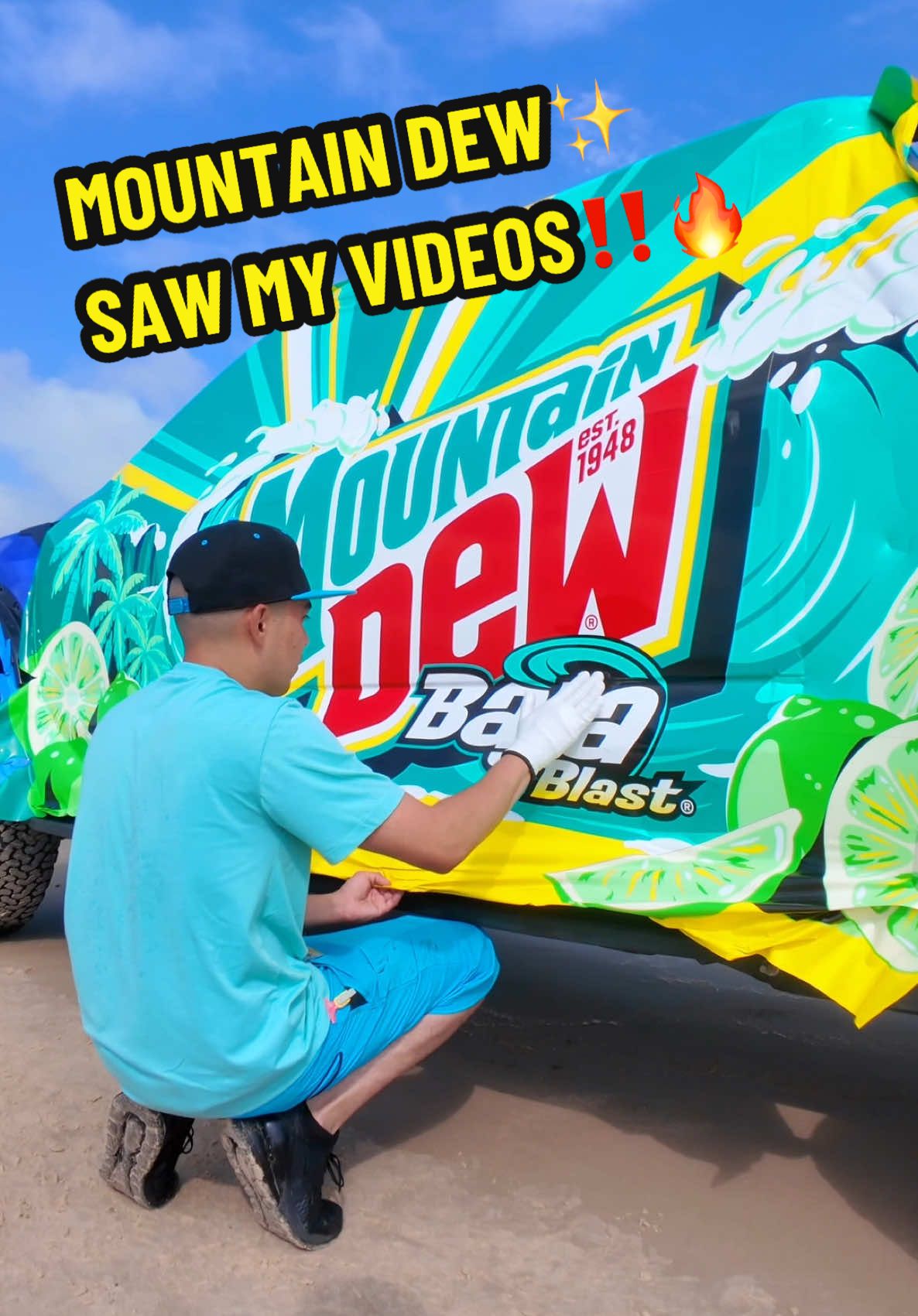 TikTok post by @jaythewrapspecialist for Mountain Dew. Caption reads: Car wrapping at the beach with a refreshing....