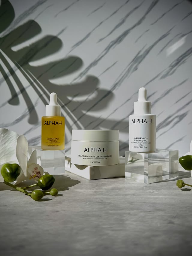 Instagram post by @minabutt84 for ALPHA-H. Caption reads: Cleanse. Flood. Seal. Glow ! The Alpha-H glow trio....