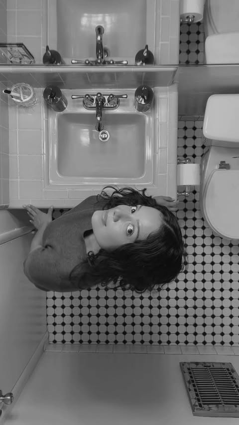 Instagram post by @lucyxlopez for Nécessaire. Caption reads: My vintage blue bathroom just got its most....
