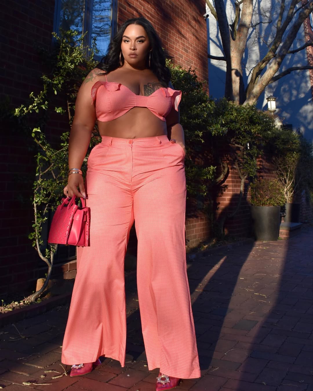Instagram post by @tayleedecastro for REBDOLLS. Caption reads: A flower does not think of competing with the....
