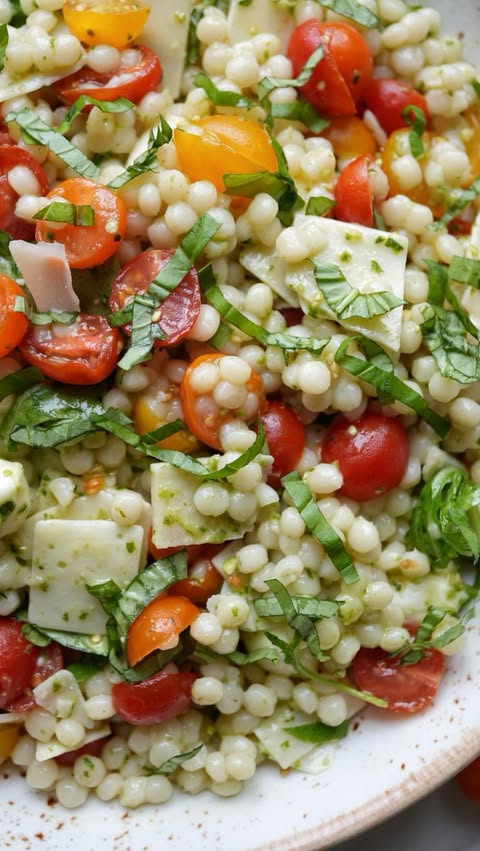 Instagram post by @thepastatable for Success Rice. Caption reads: [...] of this caprese pesto couscous using....