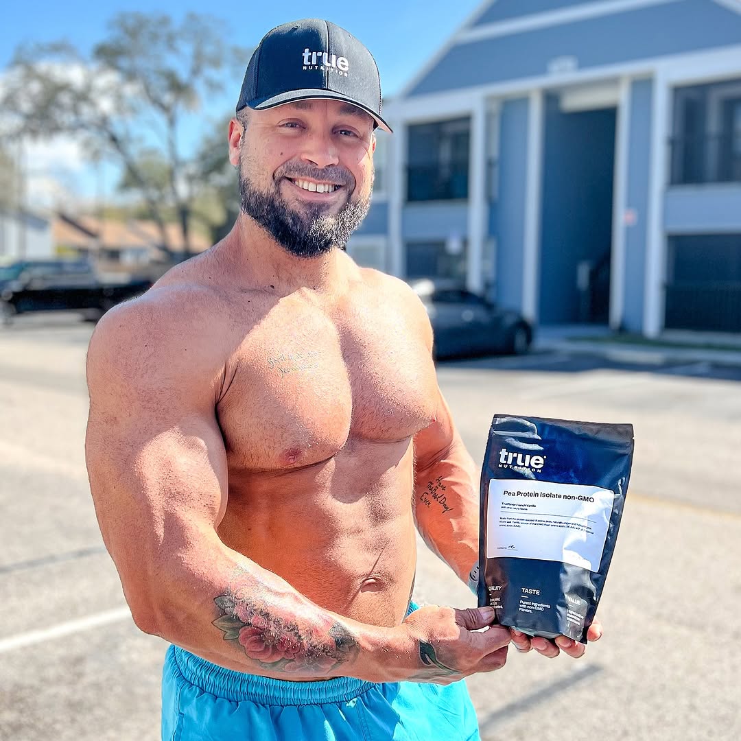 Instagram post by @thebodybuildingvegan for True Nutrition. Caption reads: [...] love some Pea Protein Isolate from....