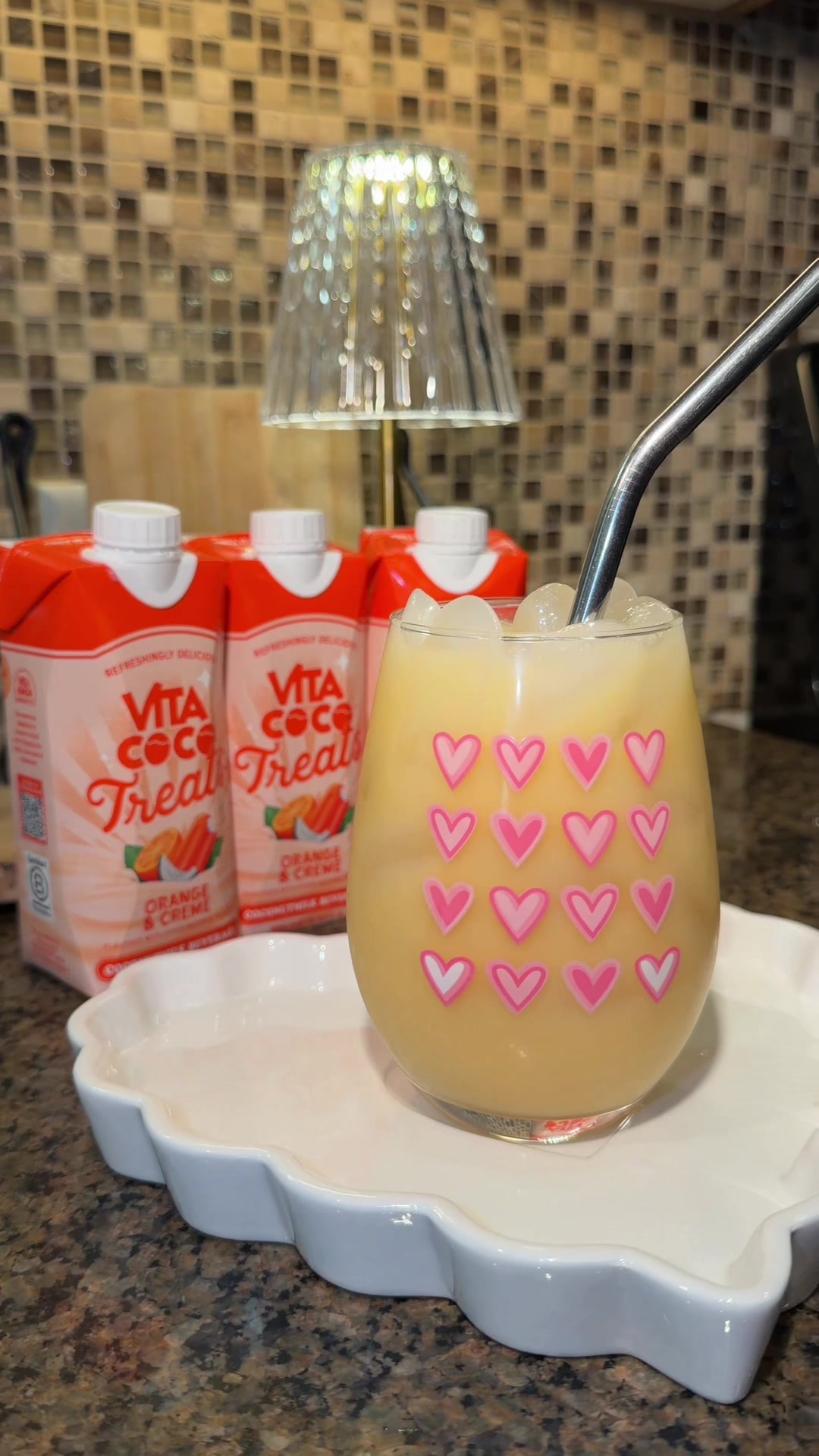 TikTok post by @yessigill for Vita Coco. Caption reads: [...] a drink 🫶🍊 Orange & Creme Vita Coco is....