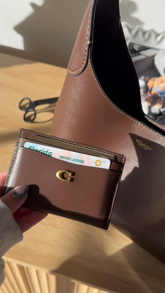 Instagram post by @fifiimarie for Coach. Caption reads: i mean i had to get the matching wallet😅🤎 @coach....