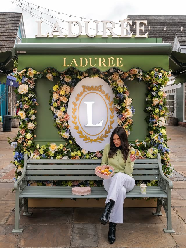 Instagram post by @prettylittlelondon for LADUREE PARIS OFFICIEL. Caption reads: ad A little escape to Bicester Village with....