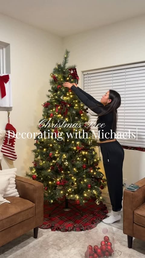 Instagram post by @llibbygardner for Michaels Stores. Caption reads: christmas tree decorating with @michaelsstores....