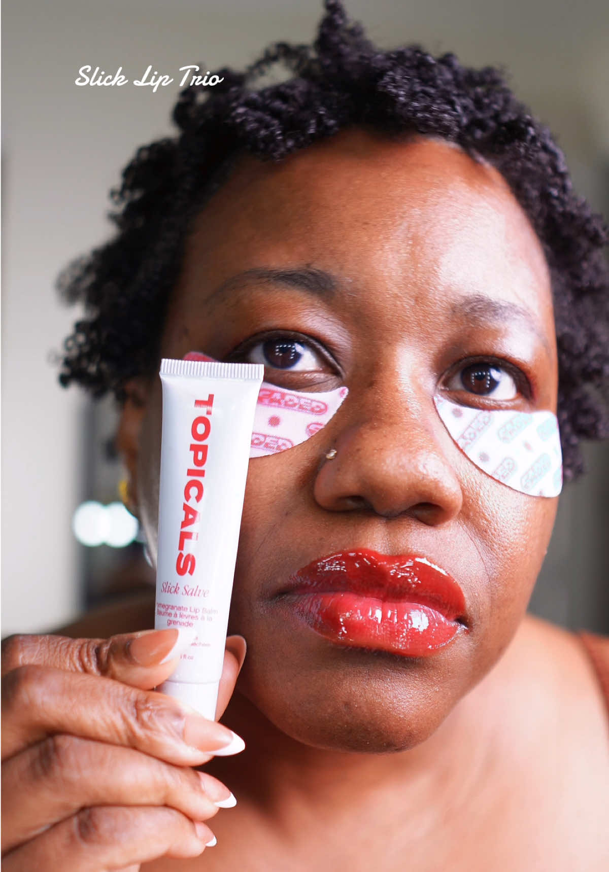 TikTok post by @lashaunbiggz for TOPICALS. Caption reads: #slickliptrio #slicksalve #topicals #lipbalm....