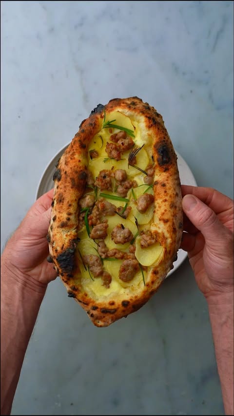 Instagram post by @theoneeighthitalian for Ooni. Caption reads: [...] of olive oil Bake for 90 seconds in the Ooni....