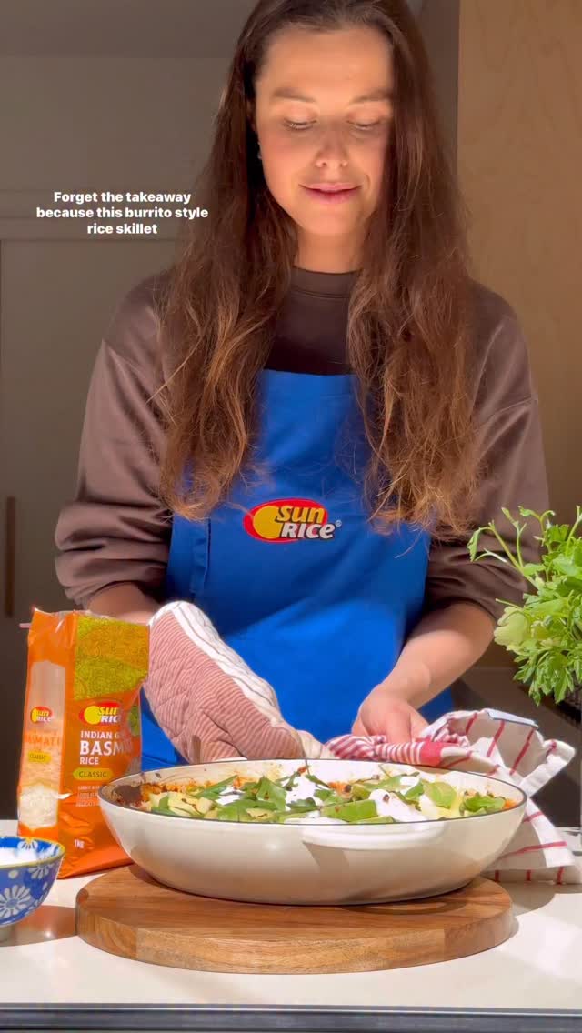 Instagram post by @liv.kaplan for SunRice. Caption reads: Forget the takeaway. This cheesy burrito-style....