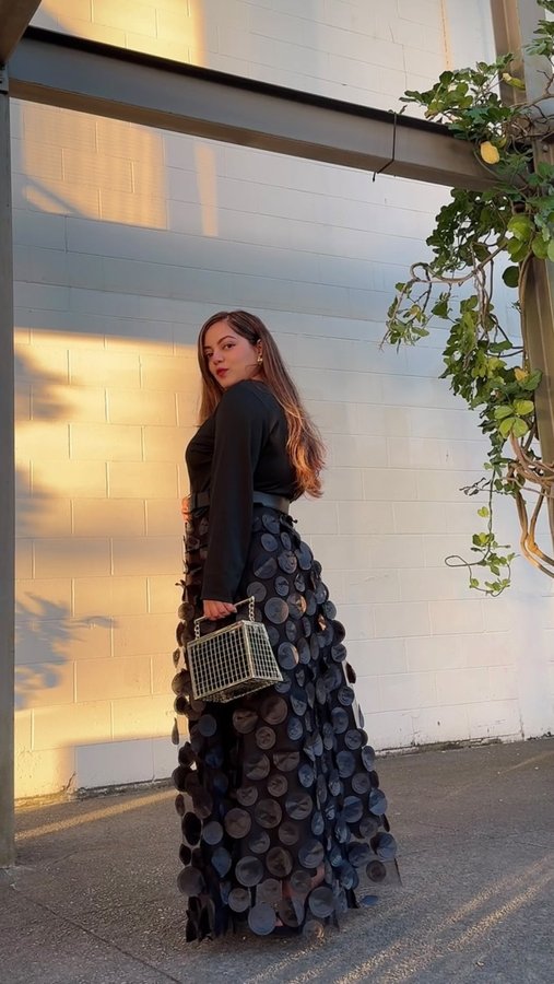 Instagram post by @shemeansstyle for Rosewe. Caption reads: Warning: wearing this black dress may cause an....