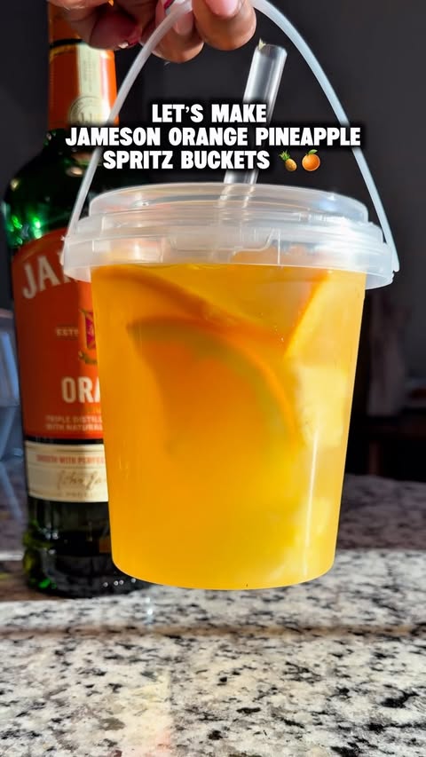 Instagram post by @_stormyblue for Jameson Irish Whiskey. Caption reads: I made Jameson Orange Pineapple Spritz Buckets for....