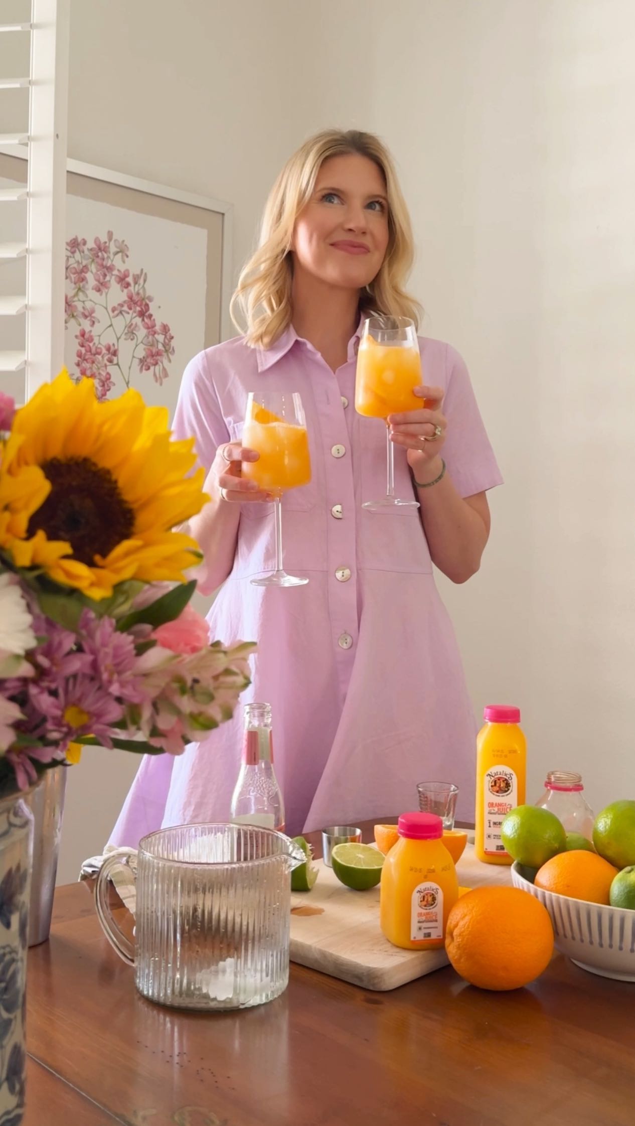 Instagram post by @ashleybrooke for Natalie's Orchid Island Juice. Caption reads: This orange Paloma with @nataliesoj is my go-to....