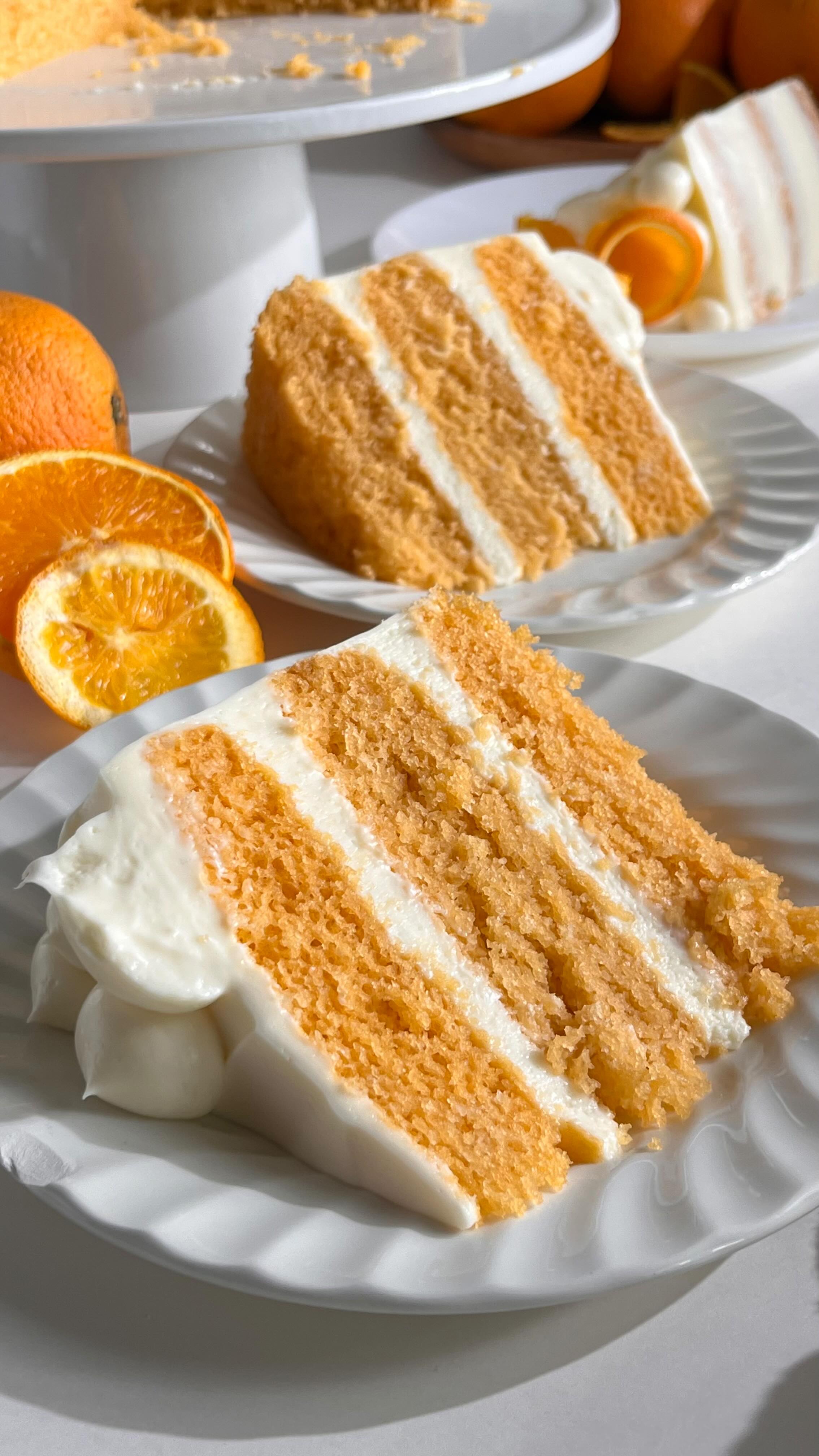 Instagram post by @pastrybysaloni for Amoretti. Caption reads: Orange Layer Cake,
soft, fluffy cake layers paired....