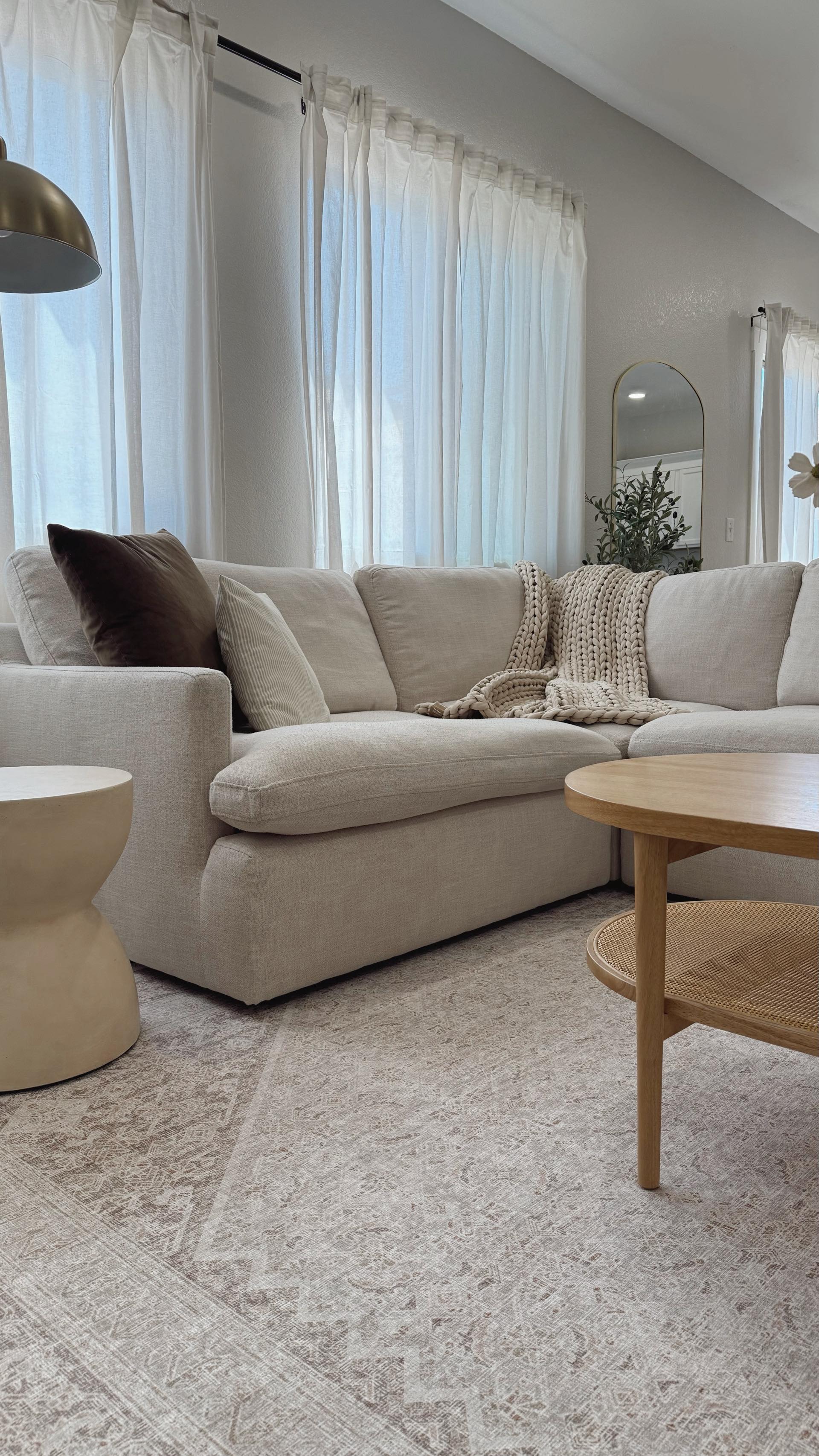 Instagram post by @alexismariemade for Tumble Circus. Caption reads: Our home feels instantly warmer and cozier with....