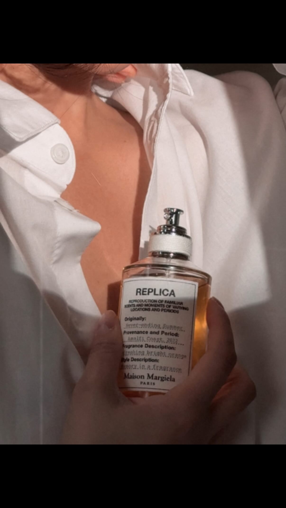 Instagram post by @thegreylayers for Maison Margiela Fragrances. Caption reads: Eternal summer? Don’t mind if I spritz.....