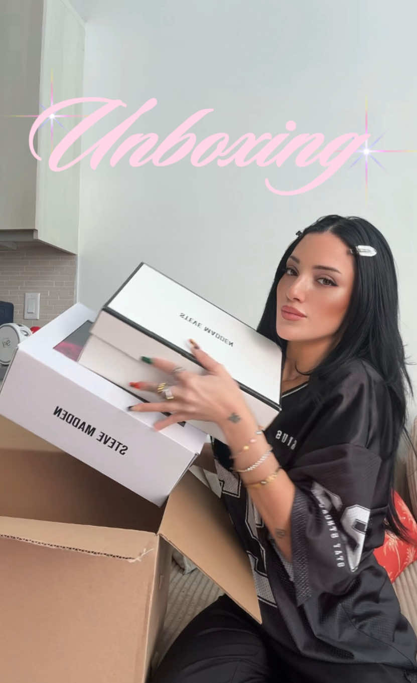 TikTok post by @nikidemar for Steve Madden. Caption reads: ARE YOU KIDDING @stevemadden 📦🎁 #unboxing....