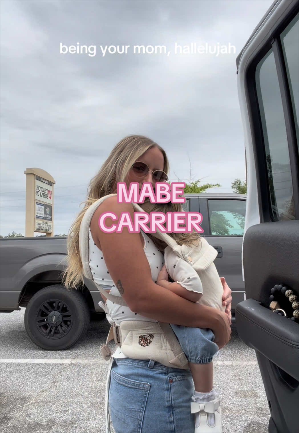TikTok post by @paigeturnerrr for MABĒ Carriers. Caption reads: [...] wanna hold and cuddle her forever 🥹 @MABĒ....