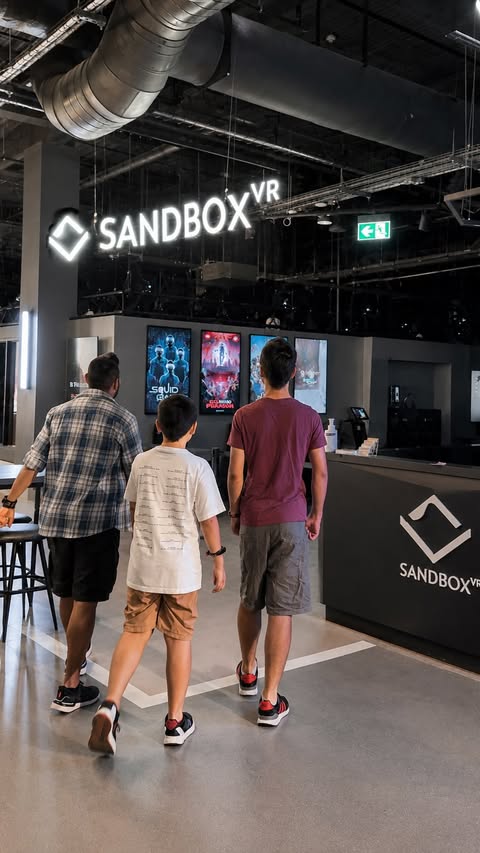 Instagram post by @our_little_life_adventures for Sandbox VR. Caption reads: [...] way too seriously. 😂 Have you tried Sandbox....