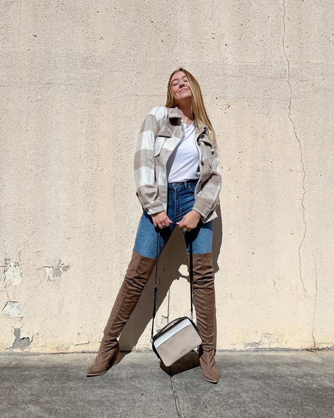 Instagram post by @kelcilockhart for InfluenceHer Collective. Caption reads: These boots were made for walking 👢, and so was....