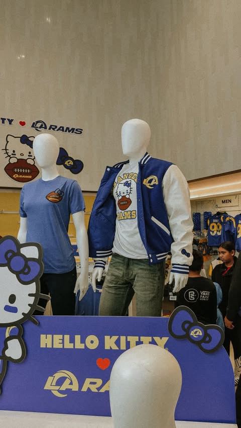 Instagram post by @_andreagabrielle for Hello Kitty. Caption reads: football is for the girls 🤭💙💛 @hellokitty x....