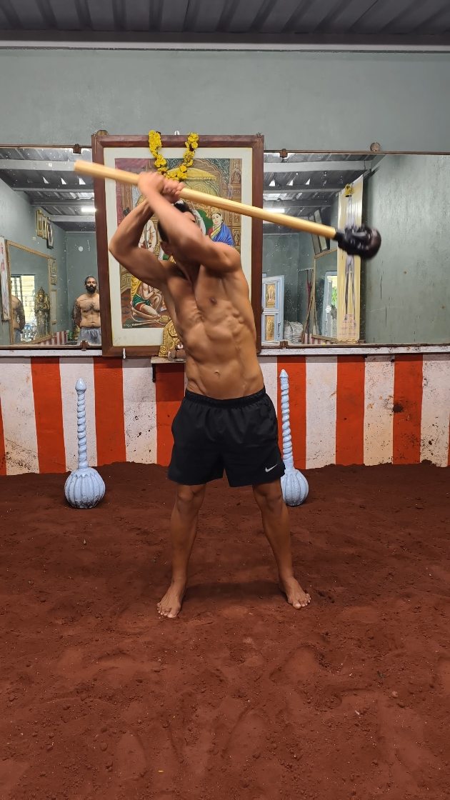 Instagram post by @santimaceflow for Onnit. Caption reads: Swinging The Quad Mace from @onnit at Garadi Mane....