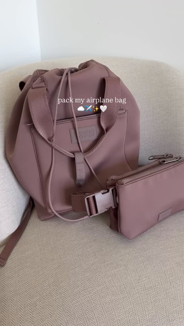 Instagram post by @alliemariedigital for Dagne Dover. Caption reads: [...] my airplane bag with me ✈️ @dagnedover just....