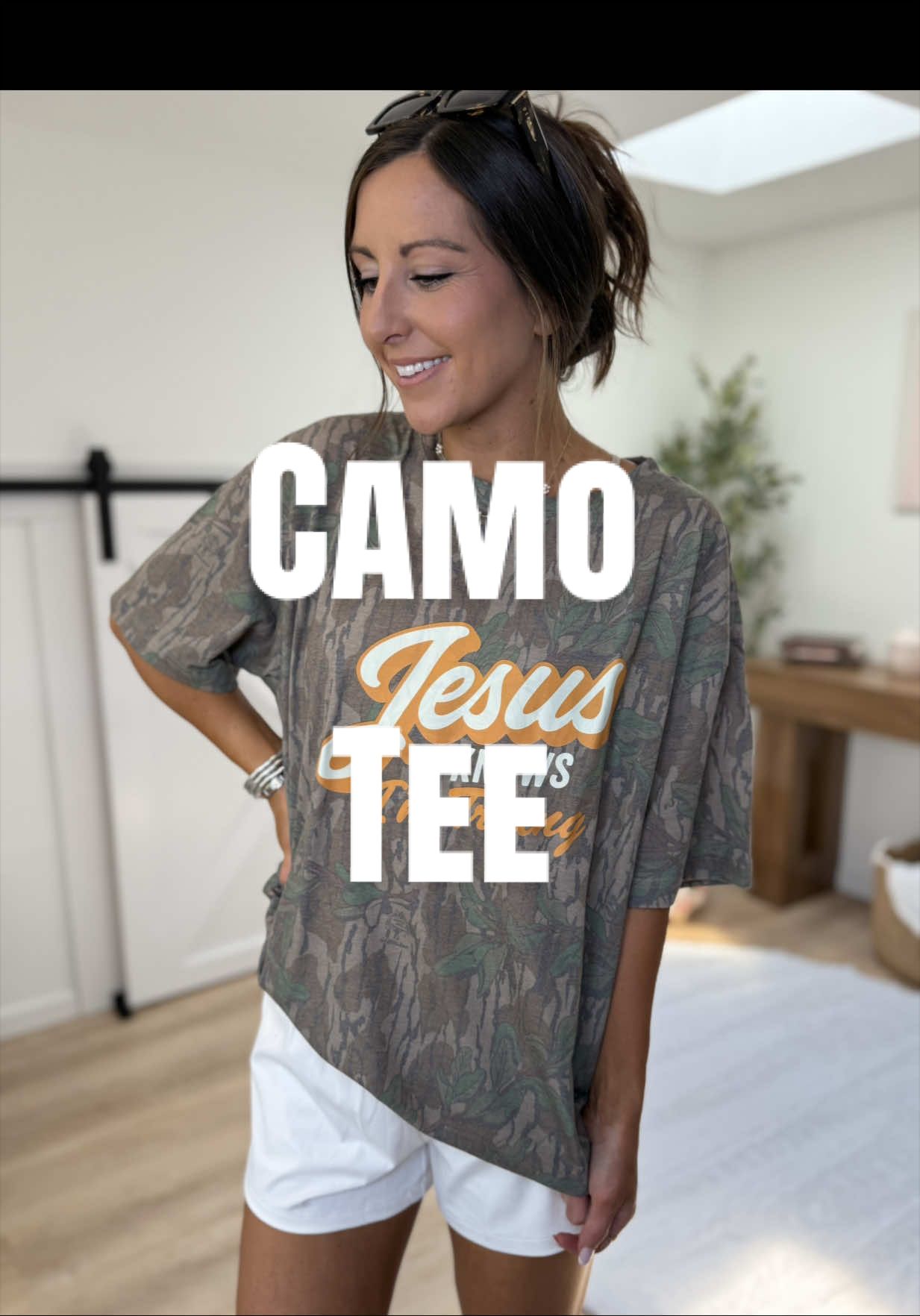 TikTok post by @shawna.likes2shop for The Mad Hatter Company. Caption reads: Jesus & camo 🤎 @The Mad Hatter Company #camotee....