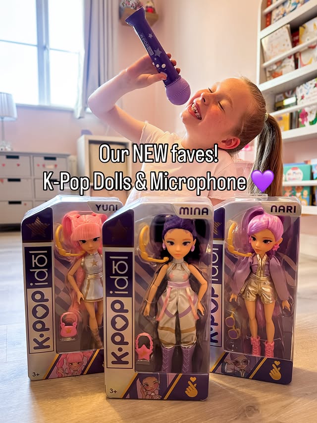 Instagram post by @our_little_family_x for Smyths Toys Superstores. Caption reads: Meet Mina, Yuni & Nari 💜✨ Safe to say K-Pop has....