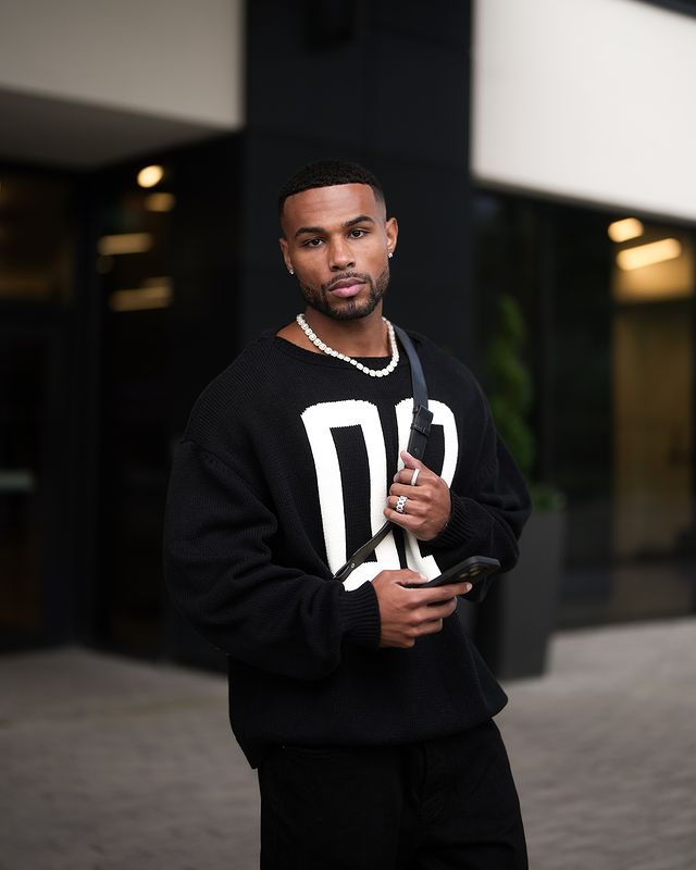 Instagram post by @joshmair96 for mnml. Caption reads: All black never fails 🥷🏽.