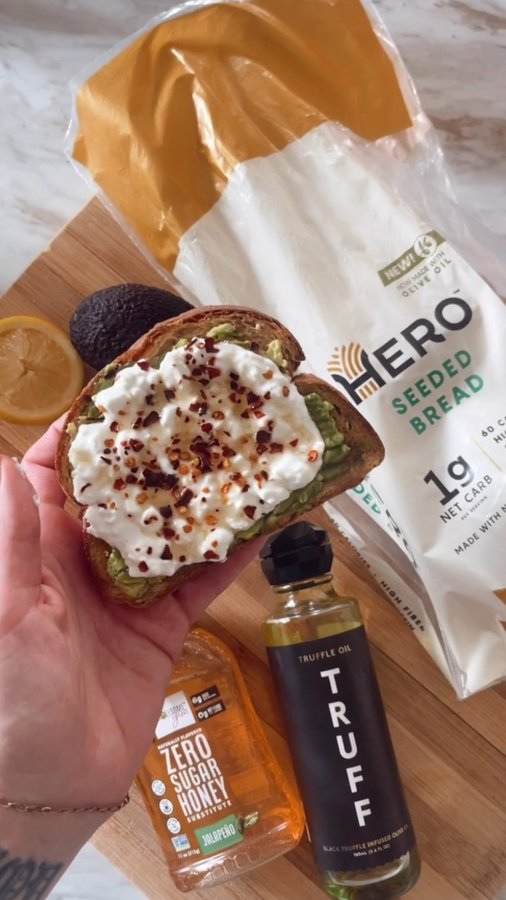 Instagram post by @ketomealrecipe for Hero Bread. Caption reads: ✨TRUFFLE HOT HONEY COTTAGE CHEESE TOAST✨recipe....