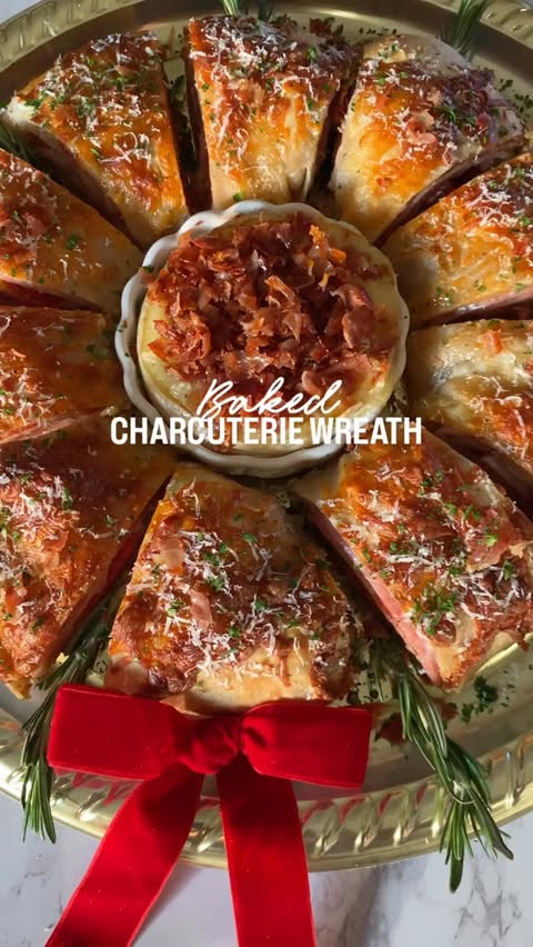 Instagram post by @shewillevolve for Dietz & Watson. Caption reads: Baked Charcuterie Wreath🎄Meet the appetizer that....