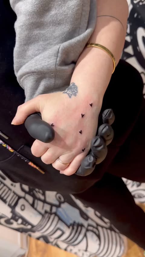 Instagram post by @nancy.amhaz.tattoos for EMALLA Official. Caption reads: Where there is love, in every touch 🤍 #love....