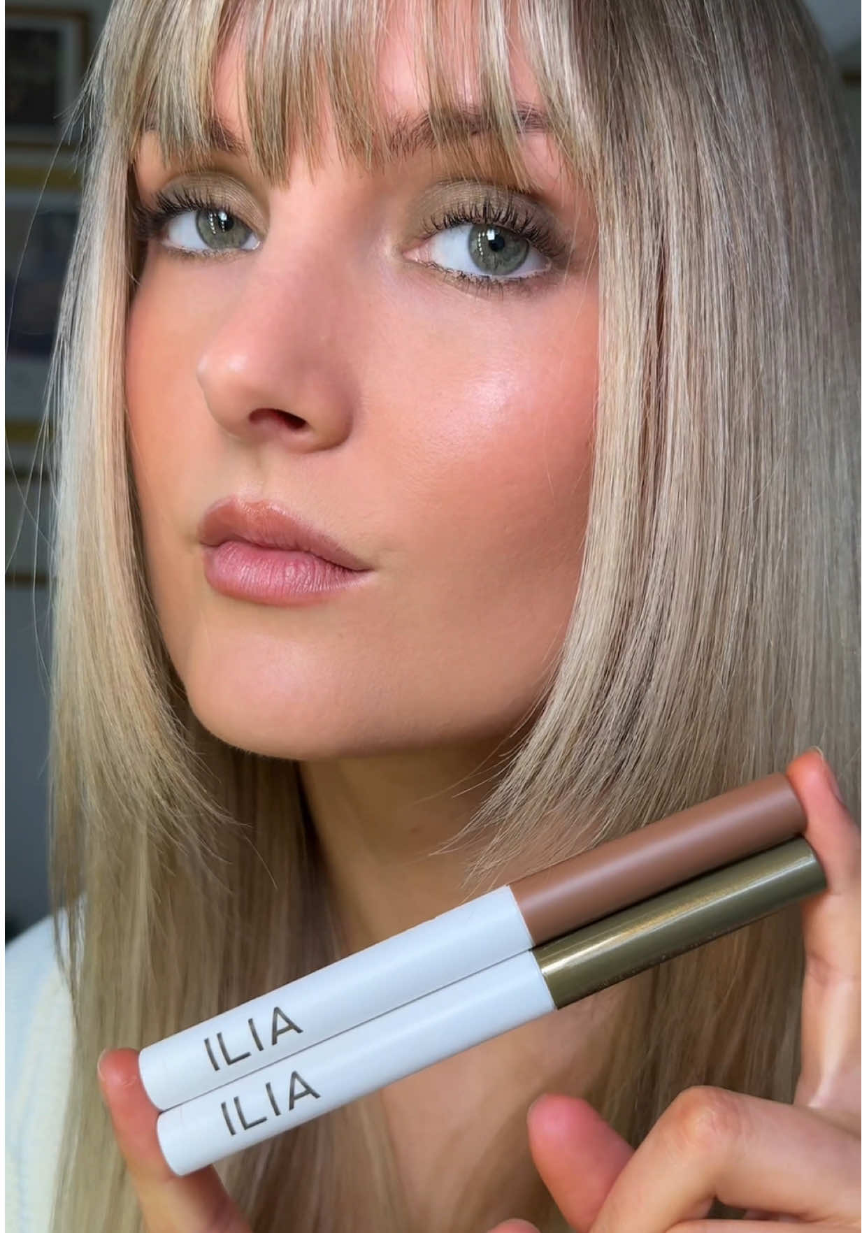 TikTok post by @anna_annora for ILIA Beauty. Caption reads: [...] color and skincare benefits @ILIA Beauty....